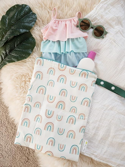 Itzy Ritzy Sealed Wet Bag with Handle – Wet Bag for Travel, Swimsuits, Cloth Diapers, Gym Clothes & Toiletries - Washable & Reusable with Water Resistant Lining - Measures 11” x 14” (Over The Rainbow)